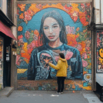 A city wall adorned with an intricate mural, transforming the urban landscape with art.