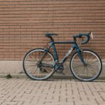A charming scene of a bicycle against a brick wall, perfect for creative photography.