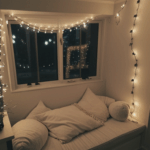A comfortable reading nook with plush seating and the soft glow of fairy lights.
