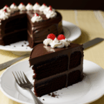 A decadent slice of chocolate cake with a rich, creamy texture, ideal for sweet indulgence.