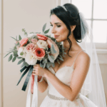 An elegant bridal pose with a stunning bouquet in hand.