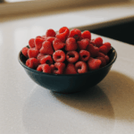 A kitchen counter featuring a decorative bowl of fresh fruits, showcasing their natural allure.