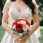 Iconic bridal pose with a bouquet, reflecting timeless elegance.