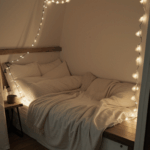 An inviting reading space with a comfy chair and ambient lighting from fairy lights.