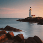An inspiring lighthouse at sunset on a rocky coast captures nature's beauty.