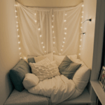 A literary escape nook with fairy lights providing a peaceful reading atmosphere.