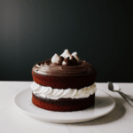A moist chocolate cake with a perfect crumb, enticing chocolate lovers everywhere.