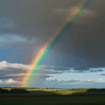 The vivid hues of a rainbow illuminate the sky, casting a serene glow over the peaceful countryside.