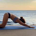 Peaceful yoga position by the coast, emphasizing mental clarity.