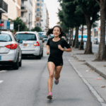 Young athlete girl in motion, feeling the pulse of the city streets as she runs.