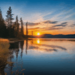 Serene reflective lake scene at the crack of dawn.