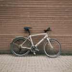 Bicycle resting by a brick wall, capturing the essence of vintage charm and serene simplicity.