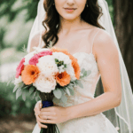 A moment of wedding love with a bride holding a bouquet.