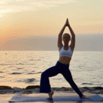 Flowing through yoga on the beach, capturing tranquility.