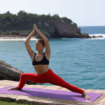 Harmony and balance achieved with yoga by the ocean.