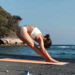 A serene yoga pose by the ocean, highlighting mindfulness and relaxation.